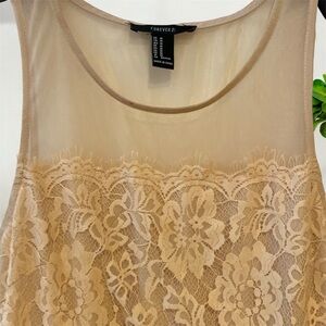 Creamy dress, has been used has a few stains but it’s still in good condition